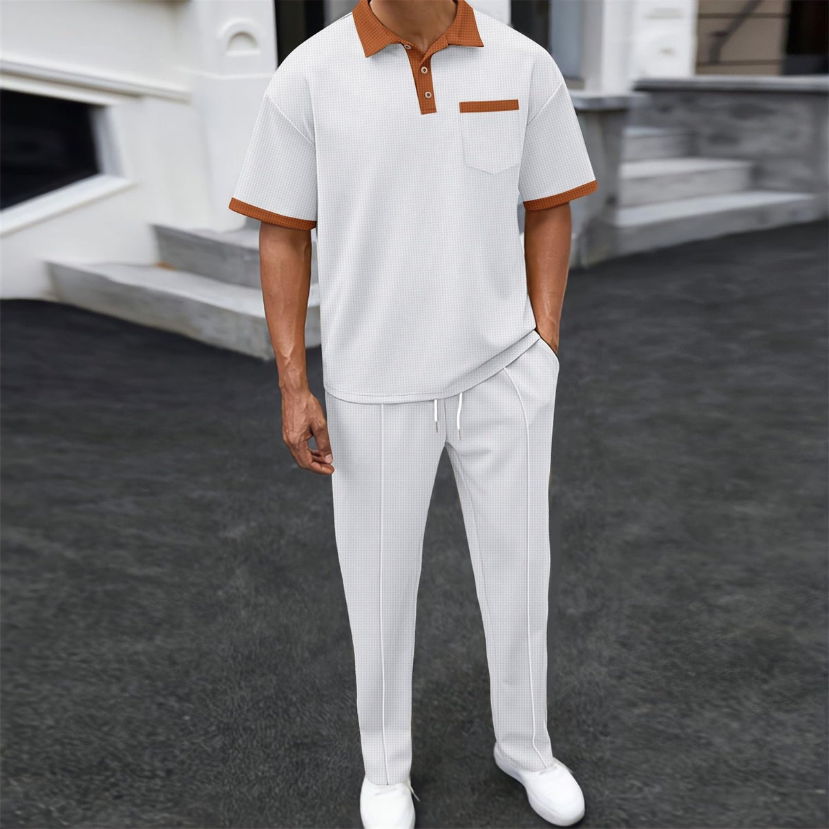KZMFROY polo shirt close-up showing contrast collar detail and folded sleeves.