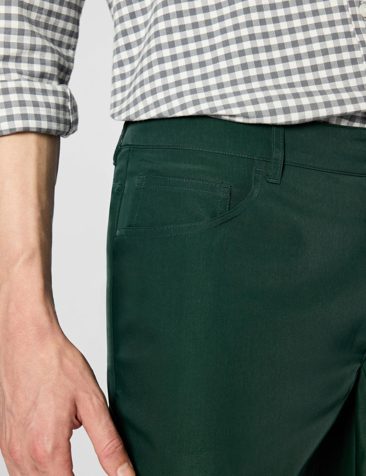 Lacoste Ultra Dry pocket detail showing 5-pocket layout for essentials