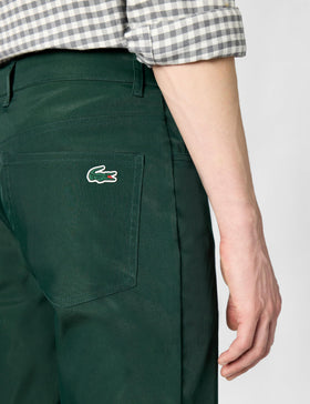 Lacoste pants with five-pocket design for practical storage during rounds on course