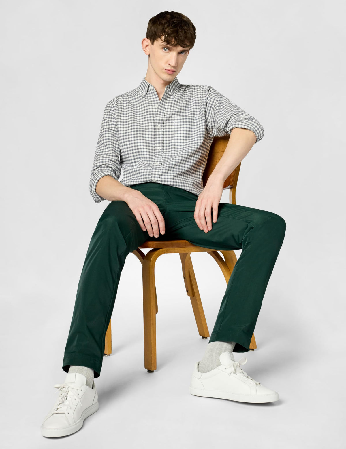 Lacoste golf pants forest green side profile showing flexible movement for on-course wear