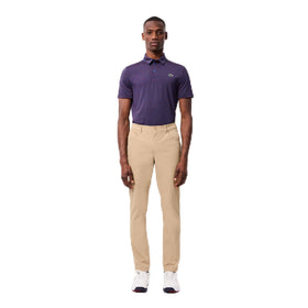 Lacoste Sport Ultra Dry slim-fit golf pants ochre, front view highlighting sleek athletic silhouette.
