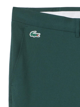 Lacoste Sport Ultra Dry slim-fit pants side view with practical pockets for on-course essentials.