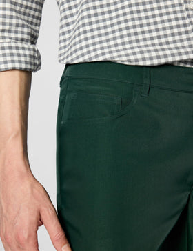 Lacoste Sport Ultra Dry Slim-Fit pants zipper area highlights secure pocket access on course.