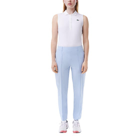 Lacoste women's sport slim-fit golf pants in Phoenix Blue with a sleek silhouette on the course
