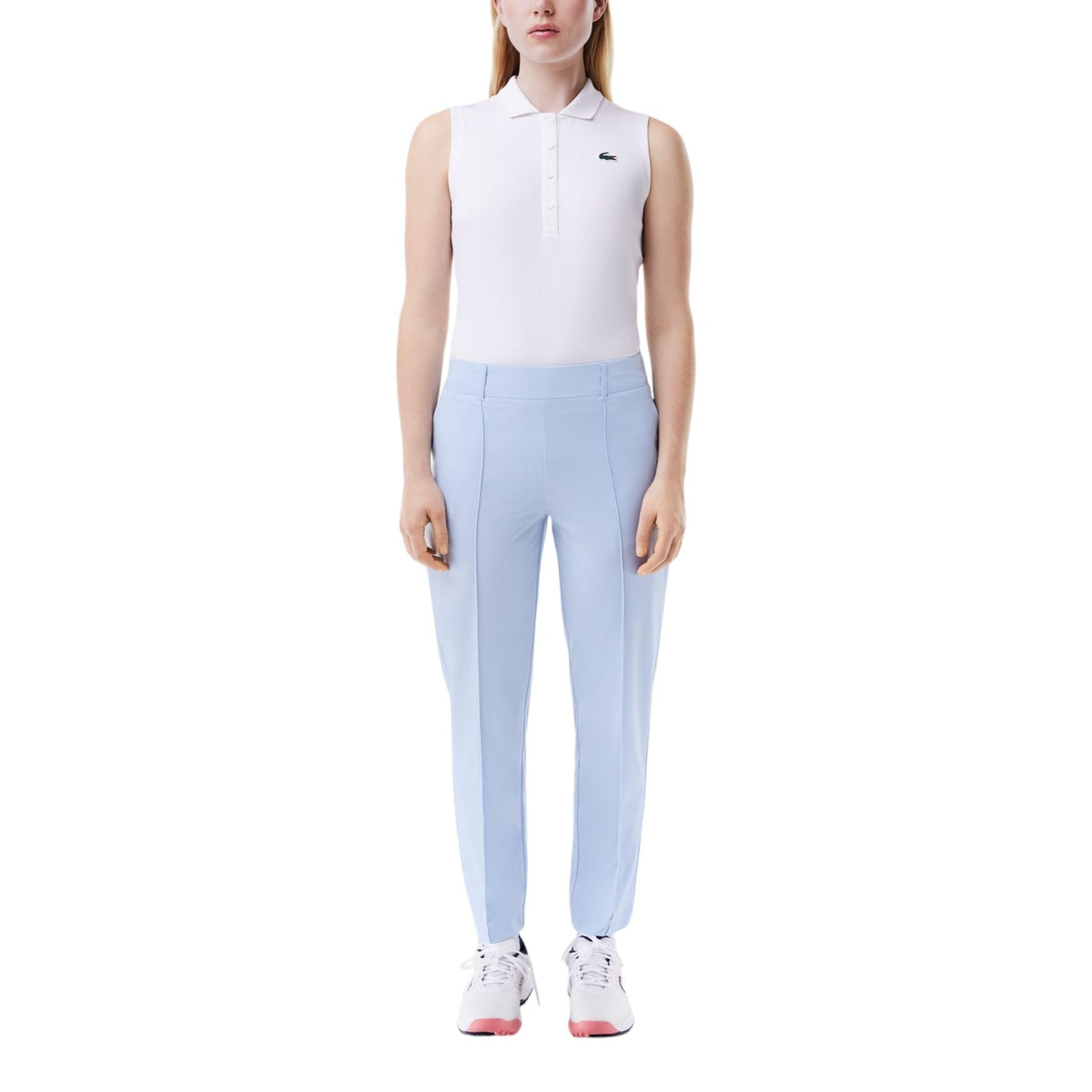 Lacoste women's Sport Slim Fit pants front view, showcasing UV protection and sleek silhouette.