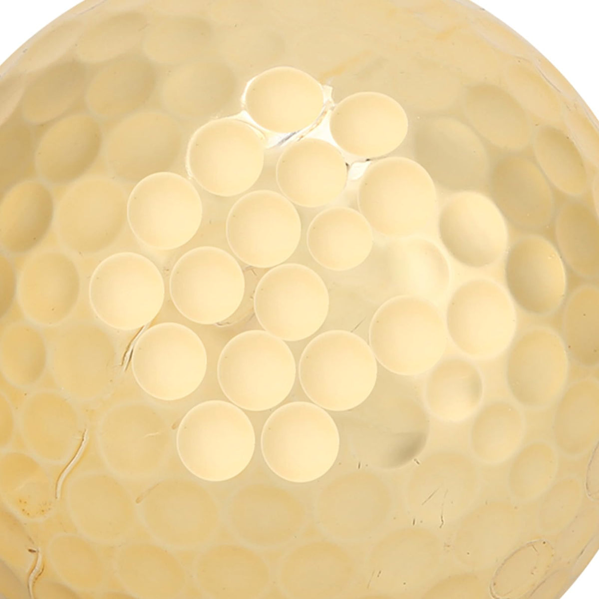 High-contrast gold ball against green for improved visibility.