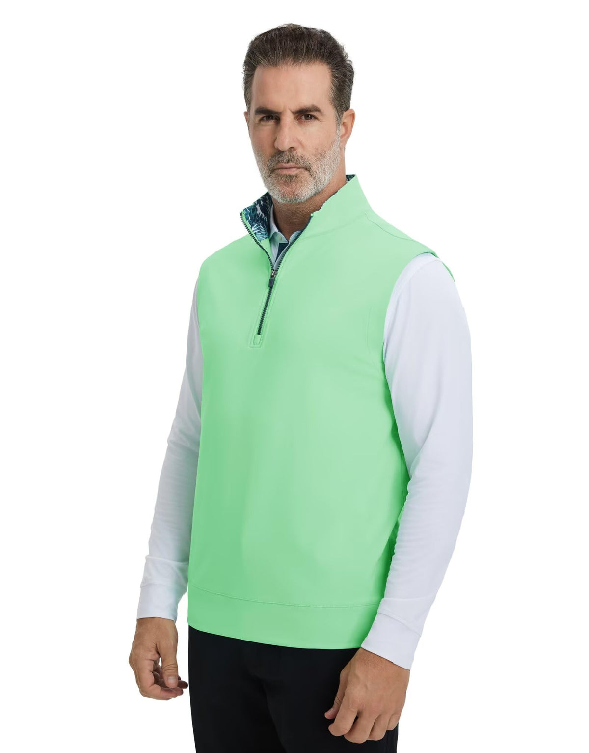 M MAELREG vest worn over a polo demonstrates a versatile mid-layer look.