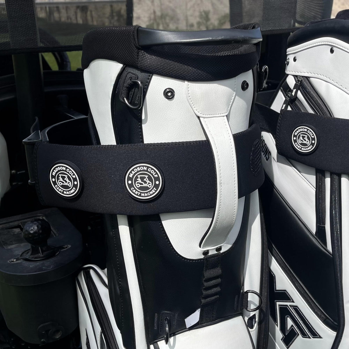 MADSON GOLF magnetic cart sleeve strap secures lightweight accessories for quick access.