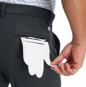 Maelreg golf pants with button front and zip fly for a tailored fit.