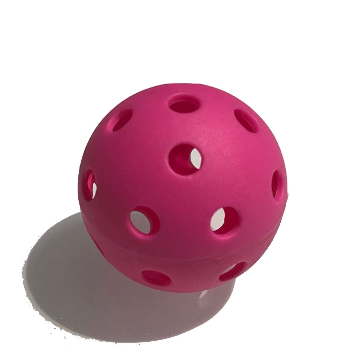 MaxBP golf-size pink training ball for focused batting practice and drill sessions.