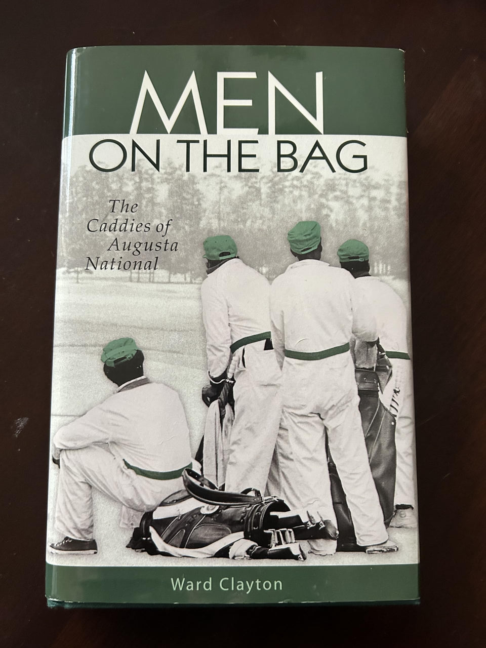 Men on the Bag book cover featuring Augusta National caddies; ideal coffee-table read for golf history fans