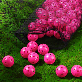 Rose red MiniInflat practice ball in backyard setting