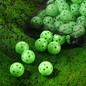 MiniInflat green practice ball in indoor practice setting for driving range training