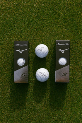 Mizuno Pro S golf ball highlighting soft feel and increased speed on impact.