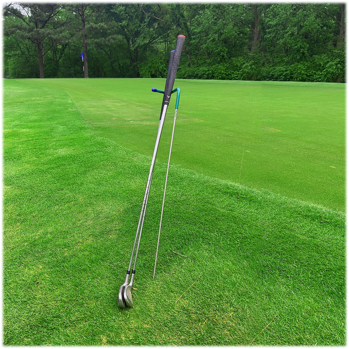 Mobile Pro Shop V shaped stand on the green keeps clubs clean and visible