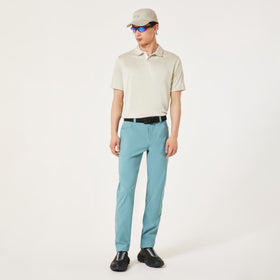 Oakley Transition Pant Pacific model wearing, versatile golf-to-street wear.