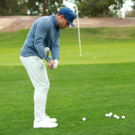 Performance Golf ONE Wedge navigating thick rough with smooth turf interaction.