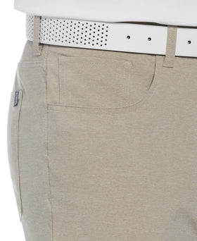 PGA Tour men's 5-pocket heather golf pant in khaki — waist closeup shows durable belt loops and texture.