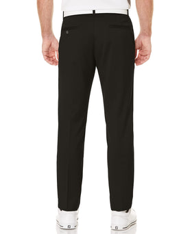 PGA Tour golf pant side view shows expandable waistband for flexible movement on swings.