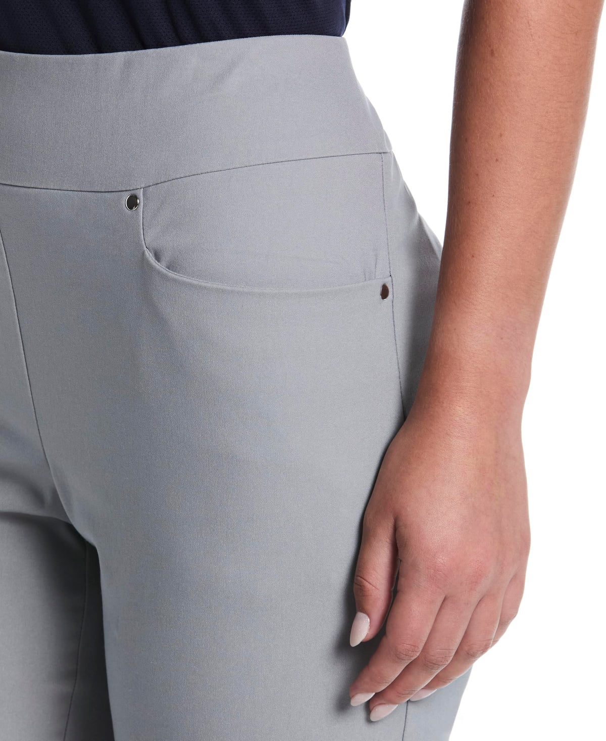 PGA TOUR tummy-control pants close-up of moisture-wicking fabric for dryness.
