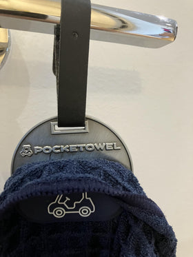 Pocketowel adjustable strap allows easy attachment to bags or carts.