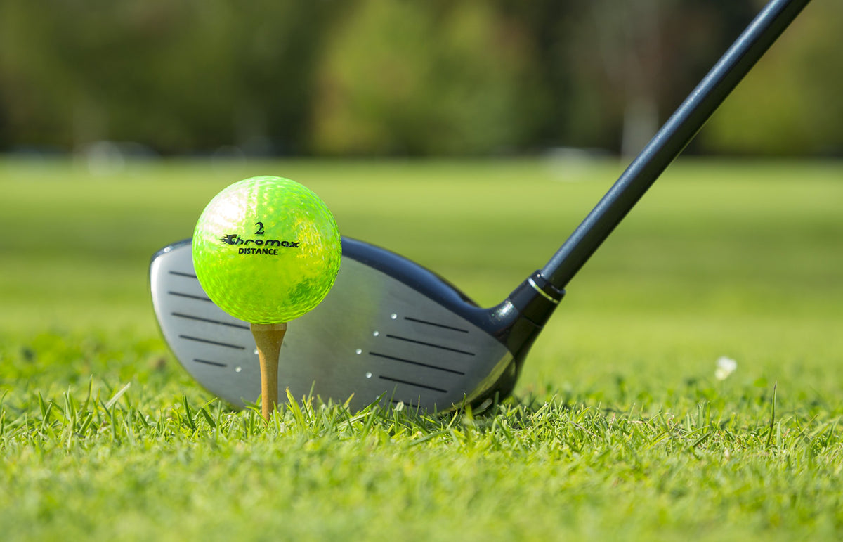 ProActive Sports Chromax Green distance golf balls during a swing for visibility and feedback