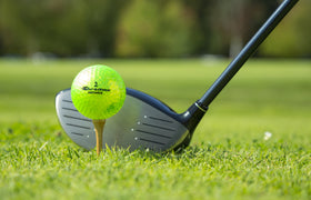 ProActive Sports Chromax Green distance golf balls during a swing for visibility and feedback