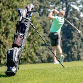 Black Sunday Stand Bag by ProActive Sports on a golf cart