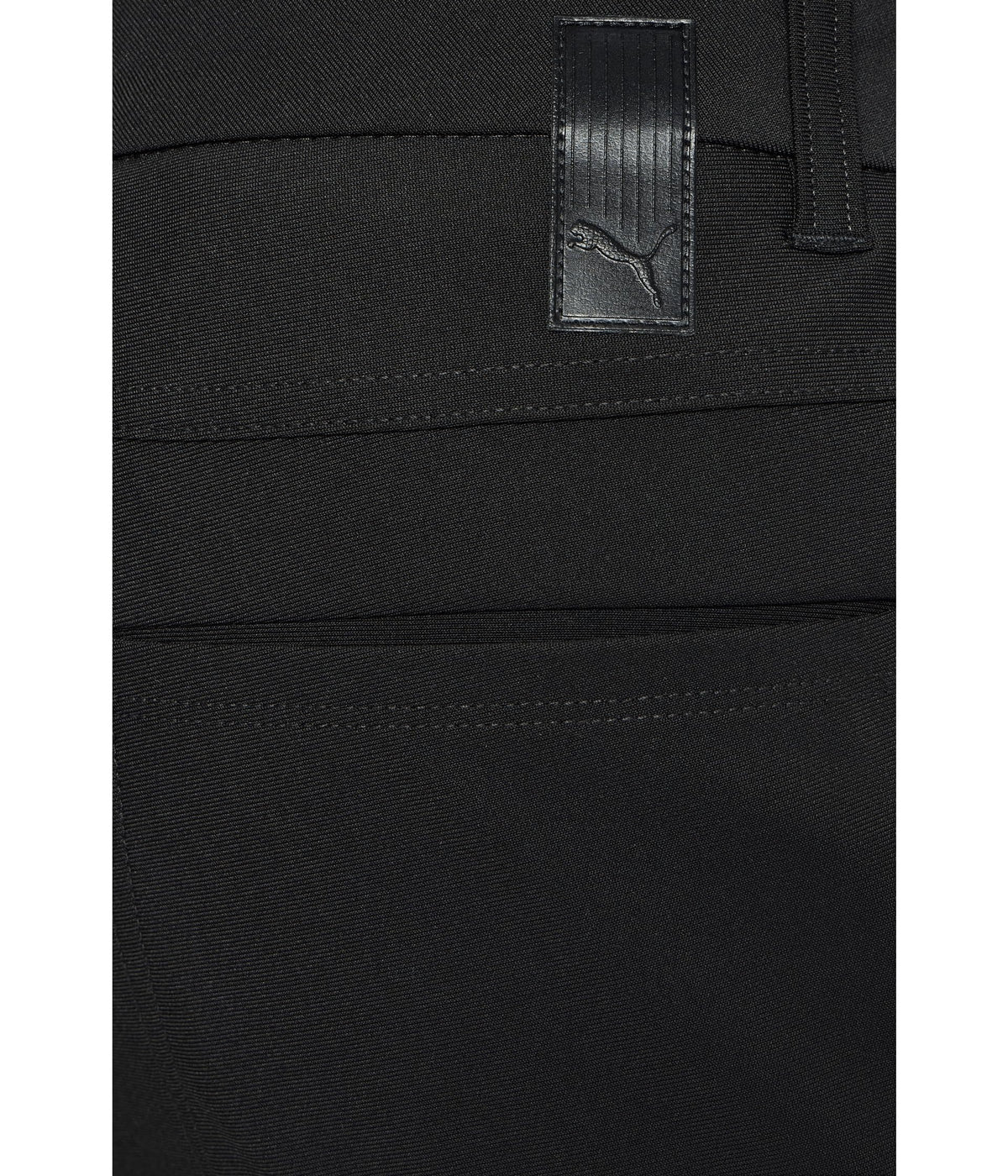 PUMA 101 Premier pants on model, versatile from course to everyday wear.