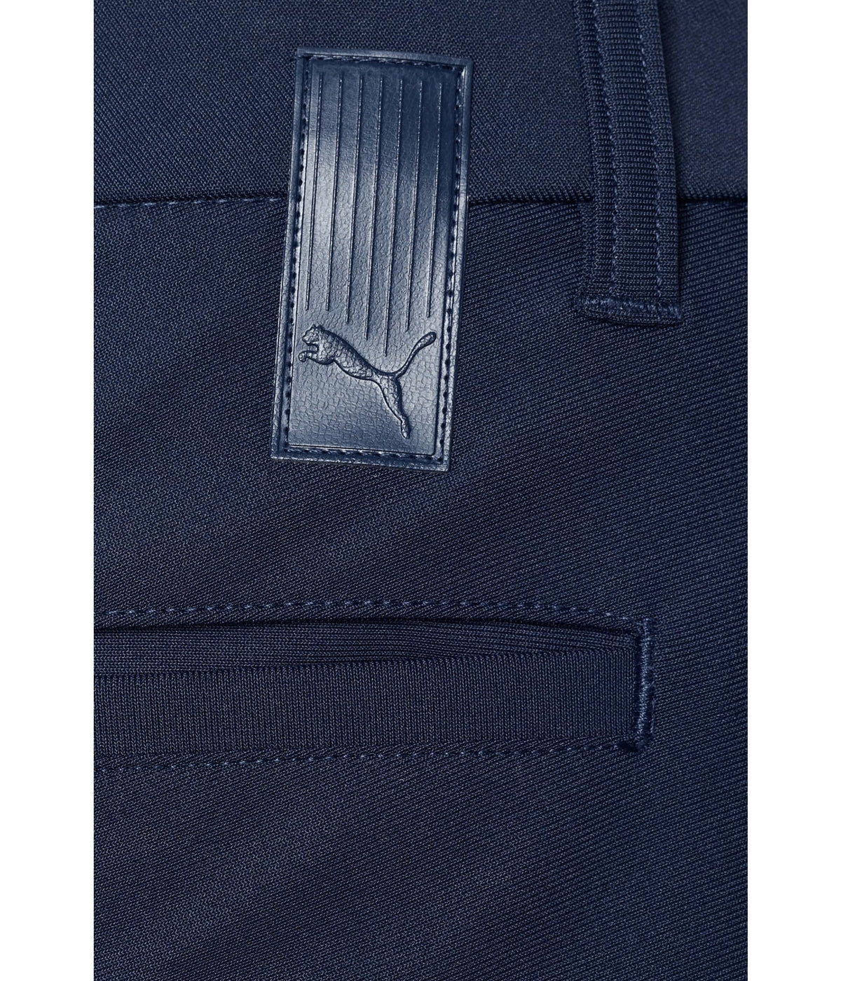PUMA 101 Premier Pants material detail in deep navy moisture-wicking fabric