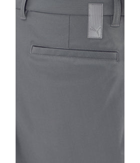 PUMA 101 Premier Pants fabric texture close-up reveals durable, breathable material.