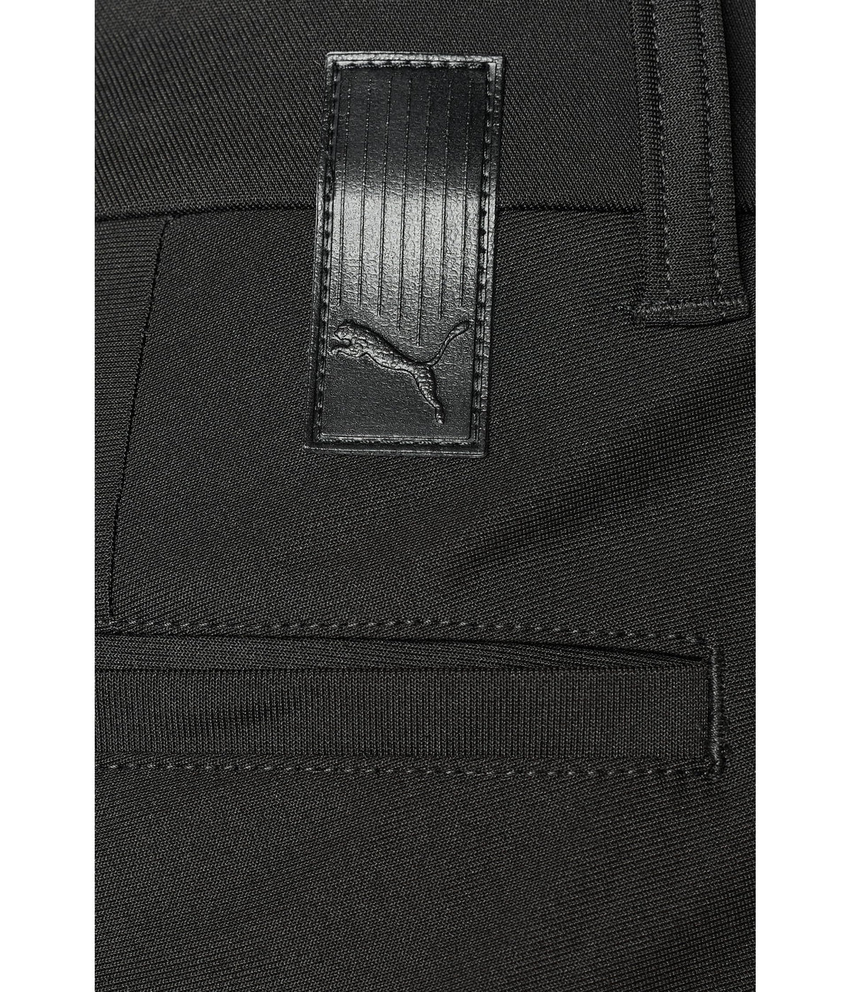 PUMA 101 Premier pants on green course demonstrating versatile performance