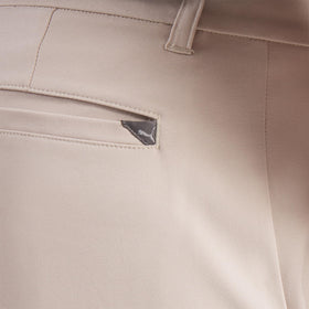 PUMA 101 Pure Tailored Golf Pant Birch – back pocket detail with woven patch for durability.