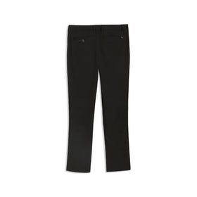 Model wearing PUMA 101 Pure Tailored pants on a sunny golf course.