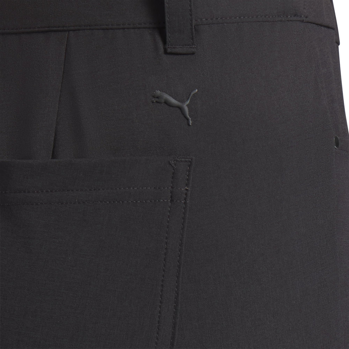 PUMA Avant Slim pants in black, side view showing flexible stretch.