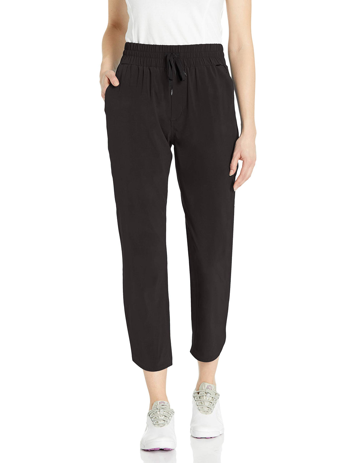 PUMA golf 2020 women's lightweight 7/8 pant in black, front view, flexible movement.