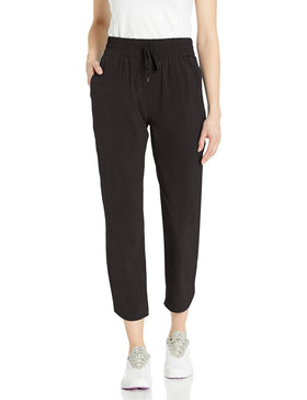 PUMA golf 2020 women's lightweight 7/8 pant in black, front view, flexible movement.