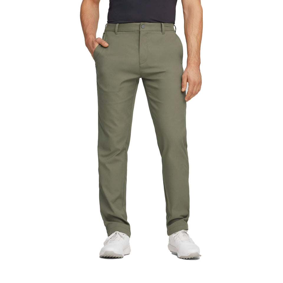 PUMA Dealer Pant dark sage front view with moisture-wicking fabric for all-day comfort.