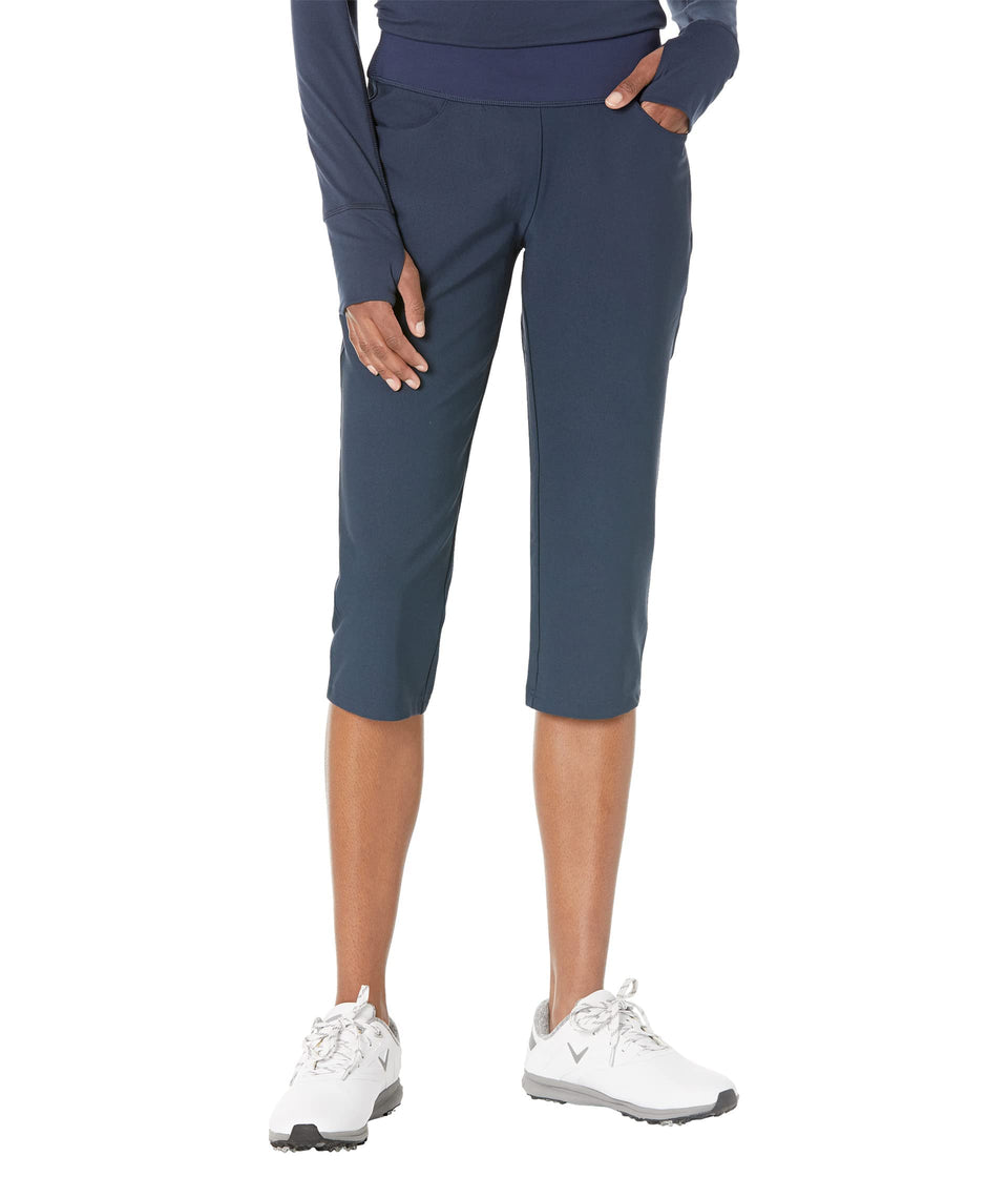 PUMA Golf Women's PwrShape Capri Pants Navy front view: sleek silhouette and stretch for on course