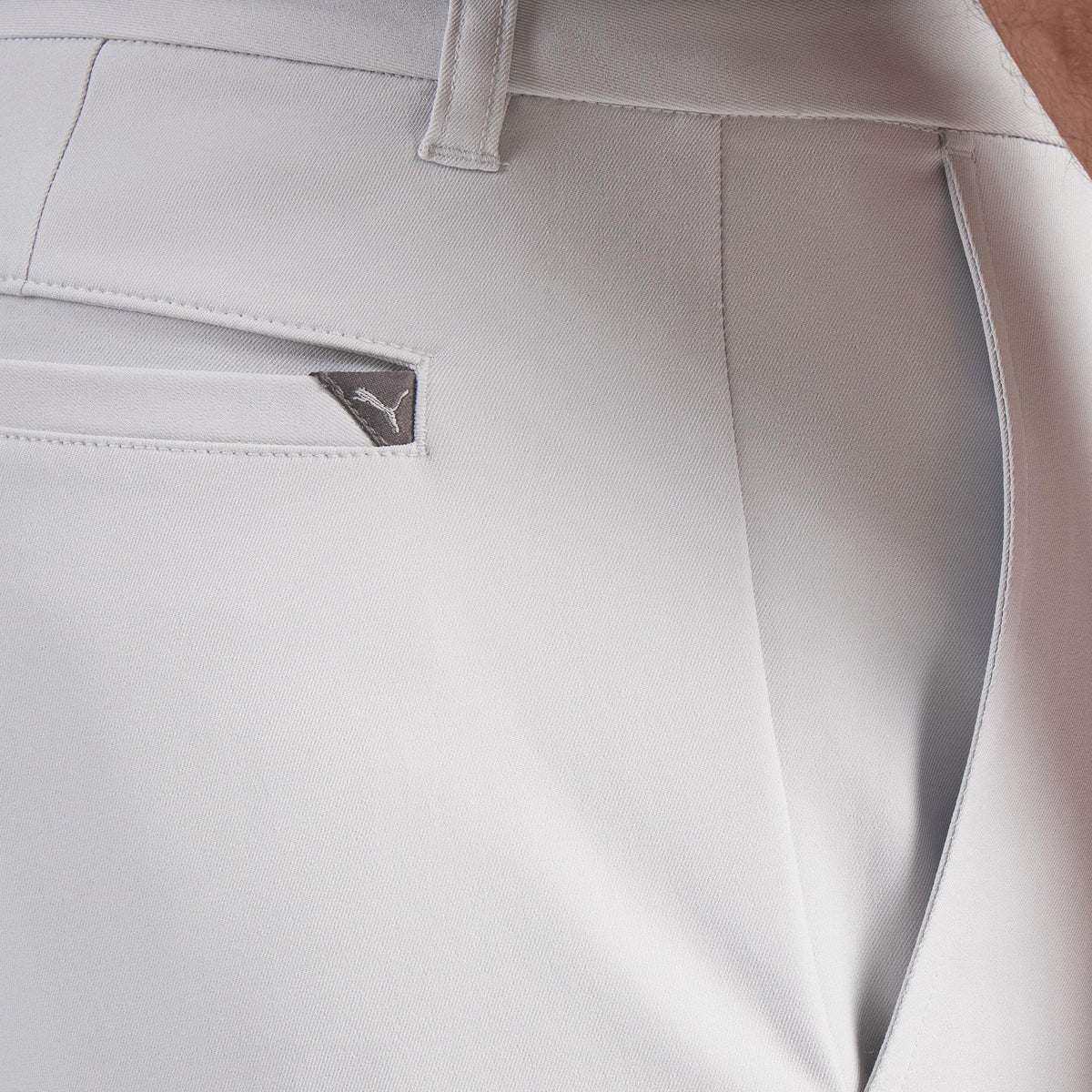 PUMA Men's 101 Pure Tailored Golf Pant back view with back welt pocket and badge.