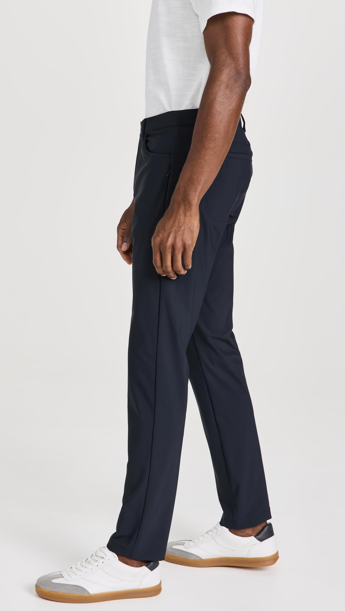 Rhone Momentum Golf Pants pocket detail showing concealed hip pocket for valuables.