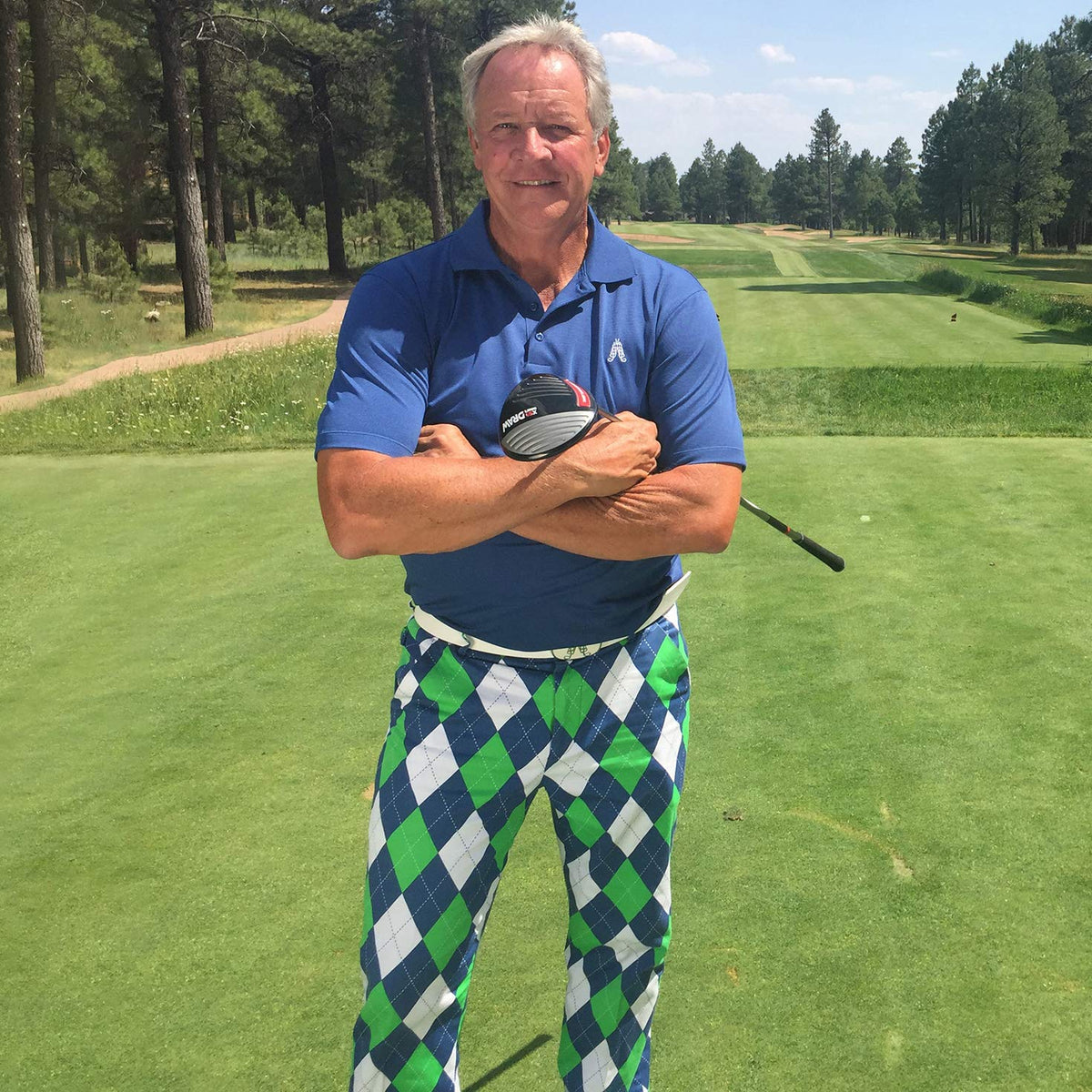Royal & Awesome King of Diamonds golf trousers side view with tee loops for on-course convenience.