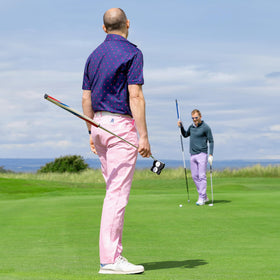Royal & Awesome pastel pink golf pants showing belt loops for adjustable fit.