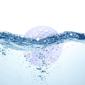 Sagsewful floating golf ball on water surface for quick retrieval in pools.
