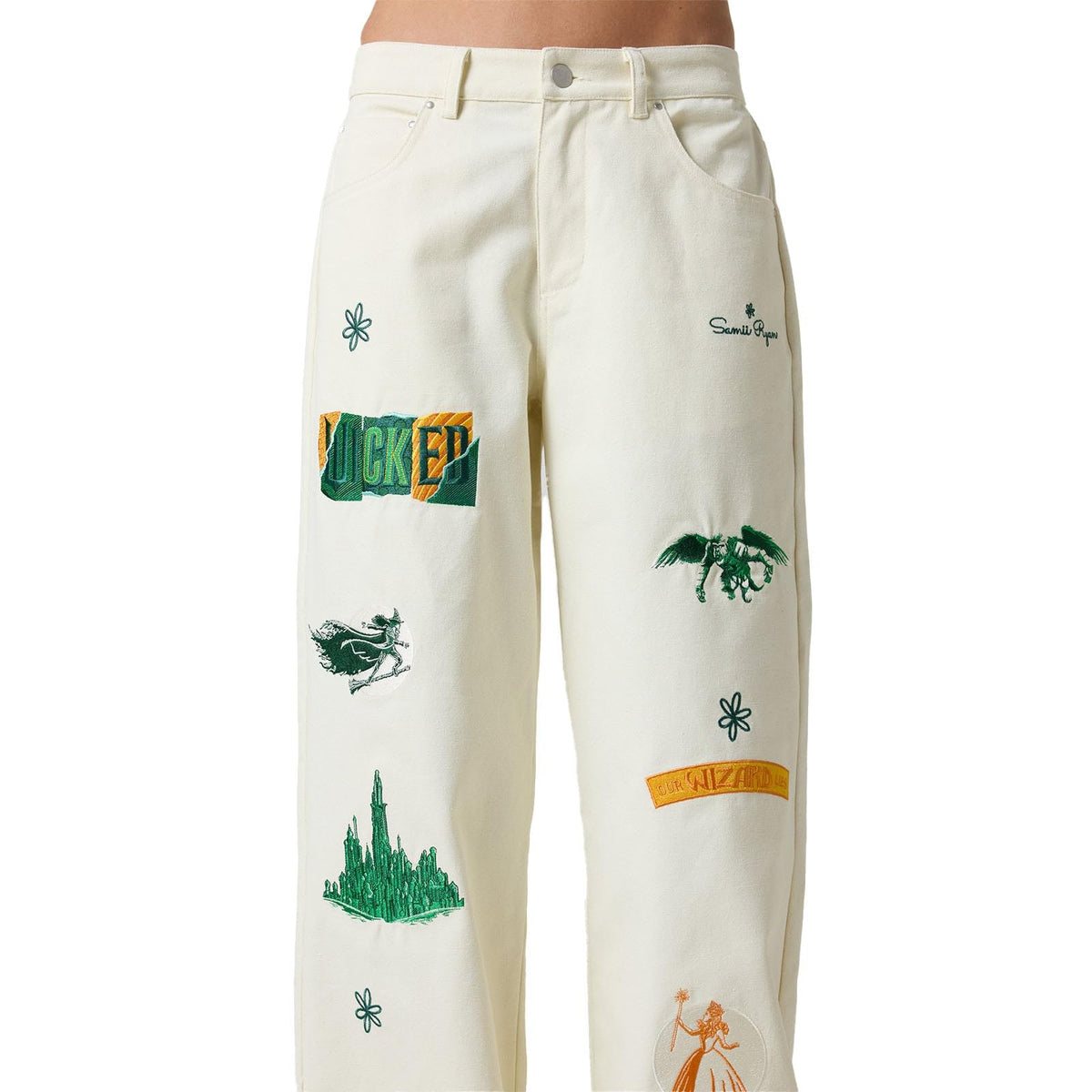 Samii Ryan Wicked x Wicked Pants Glinda-Elphaba crest adds whimsical detail.