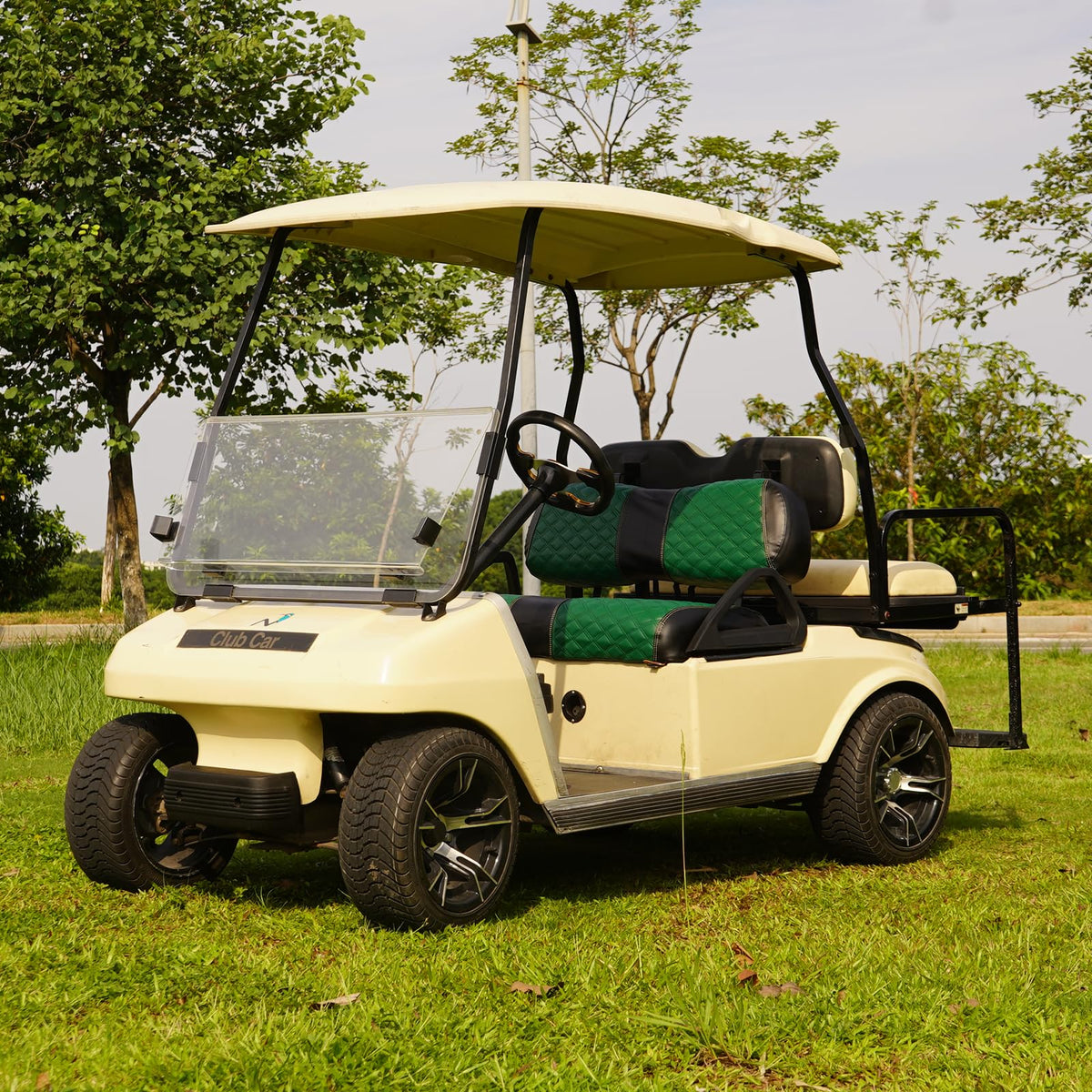 SAMXOMAP green seat covers elevate golf cart interior.