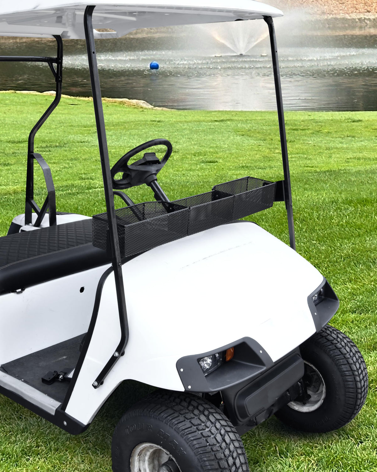 Front dash tray keeps essentials within reach during rides in SAUTVS basket.