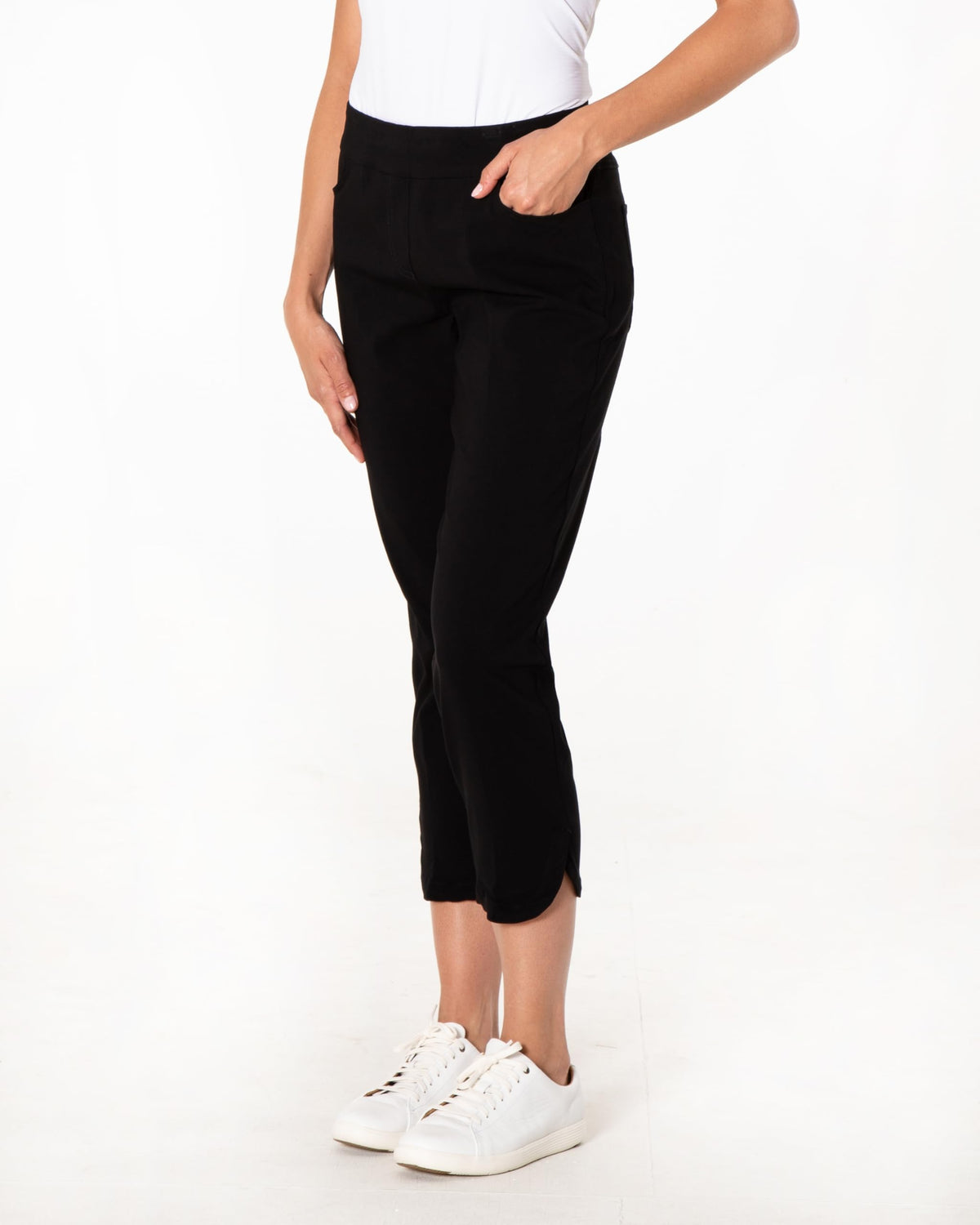 SLIM-SATION women's golf crop pants with dolphin hem ideal for versatile on-course style.