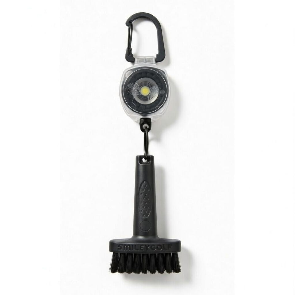 Smiley Golf mini brush with clear retractable clip for fast club-face cleaning.