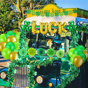 Sonwyoung paper flowers glow under parade lights for St. Patrick's Day